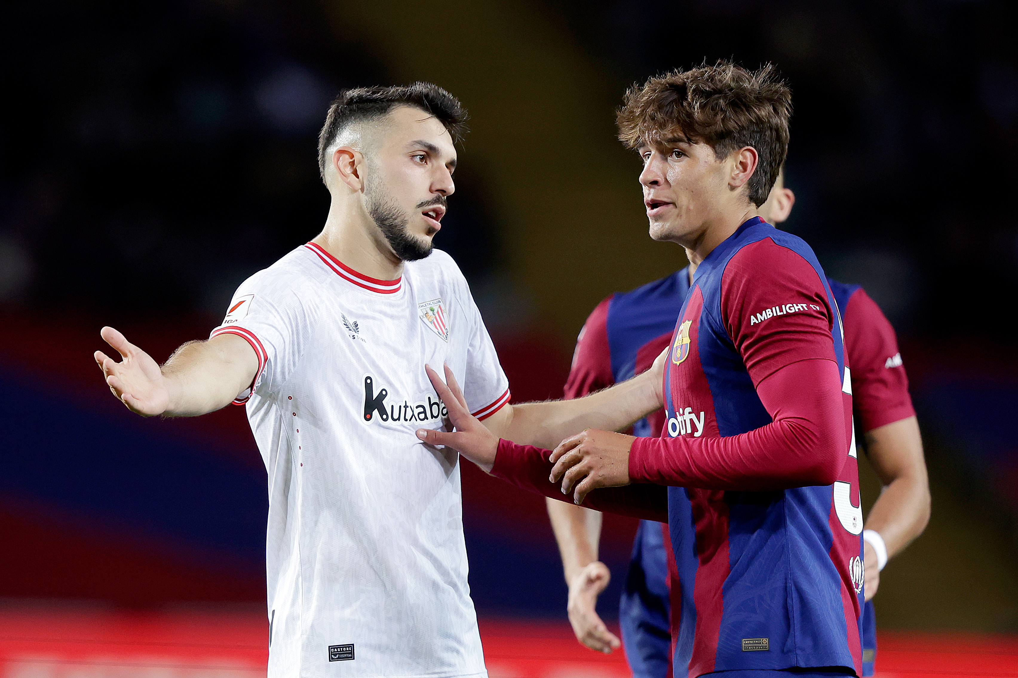  The image shows a player gesturing while another player argues with him during a match between Athletic Club and FC Barcelona on 23 May 2021, in Barcelona, Spain.